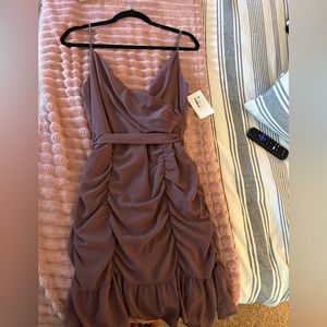 Botique dress by she +sky. Never worn with all the tags still on!